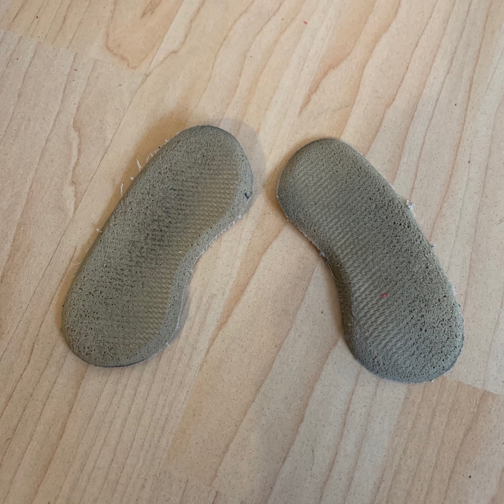 Tan heel pads in used condition without sticky